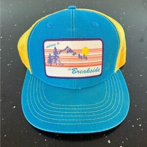 Welcome to the Breakside Blue and Yellow Mesh Trucker Hat